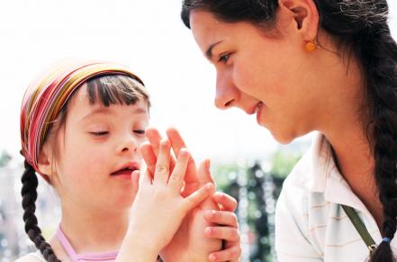 Girl and Mom comparing hand sizes