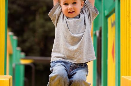 Child playing safely in a designated winter play area