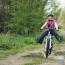 Child riding a bike outdoors