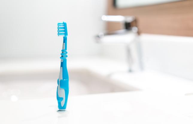 toothbrush drying next to sink