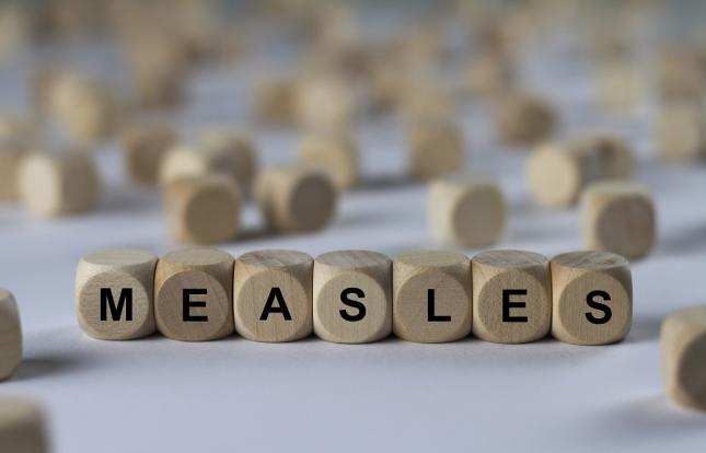 blocks spelling out the word "measles"